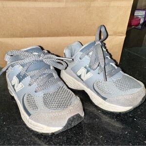 New Balance Kids Sneakers in Gray and White